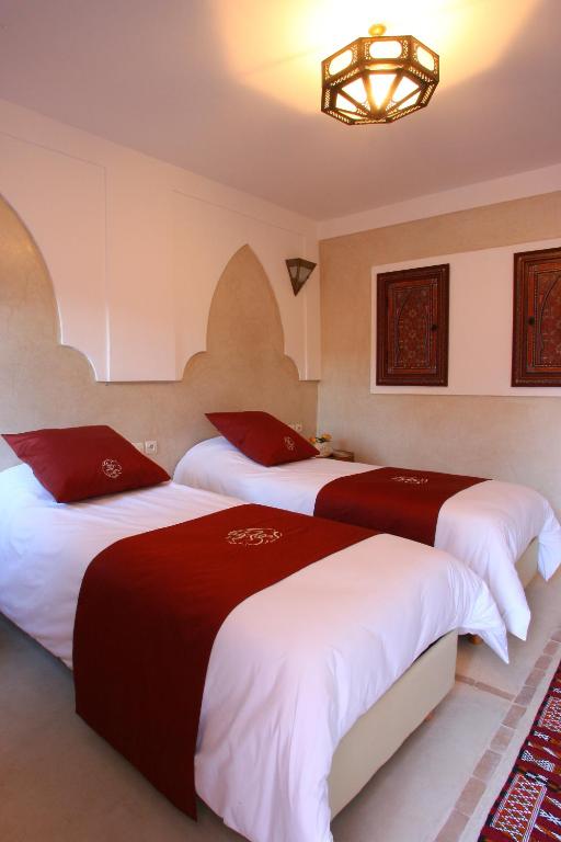 Postel nebo postele na pokoji v ubytování Riad CHERRATA