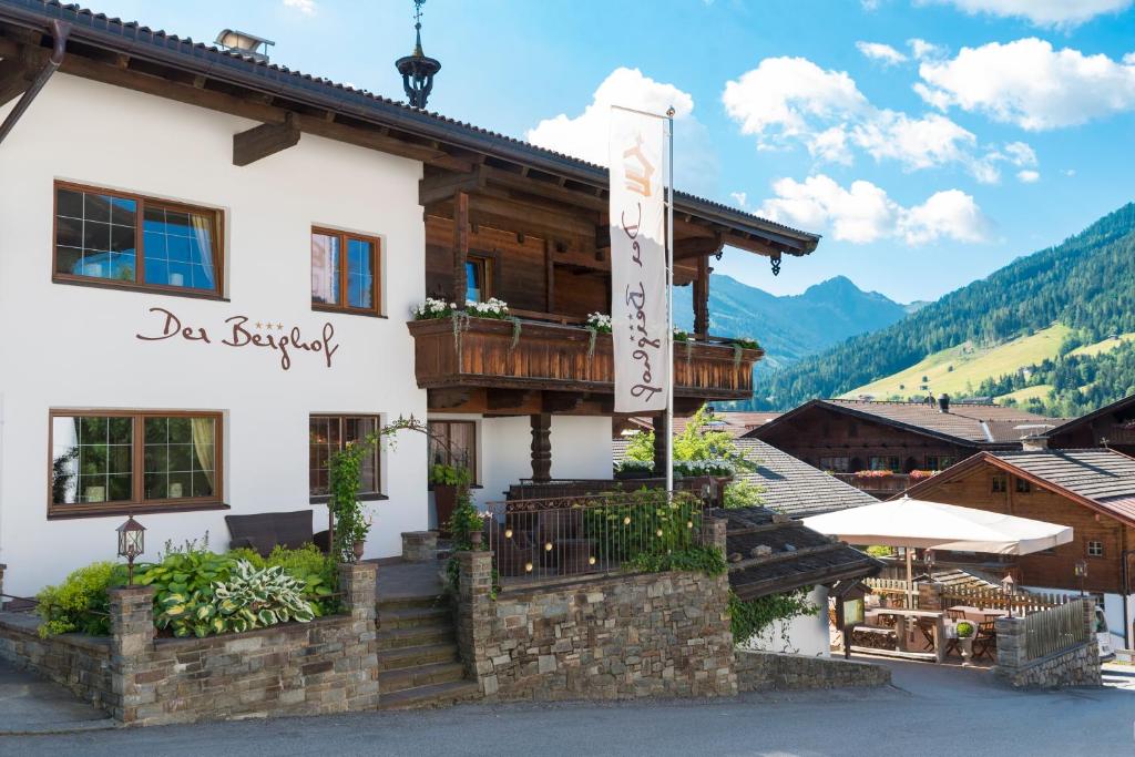 a building with a sign that reads la sagrada at Der Berghof in Alpbach