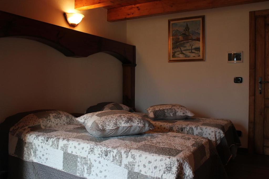 Łóżko lub łóżka w pokoju w obiekcie Maison Chenal