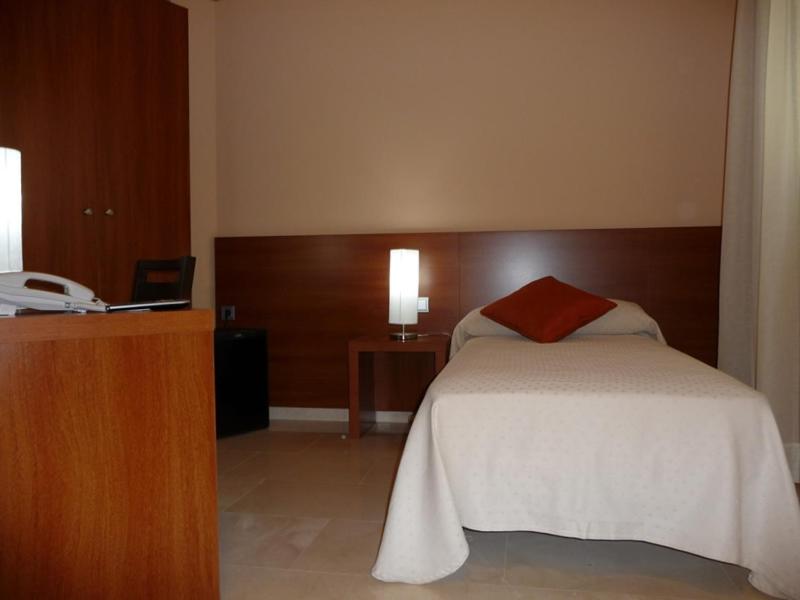 Postel nebo postele na pokoji v ubytování Hotel Verti