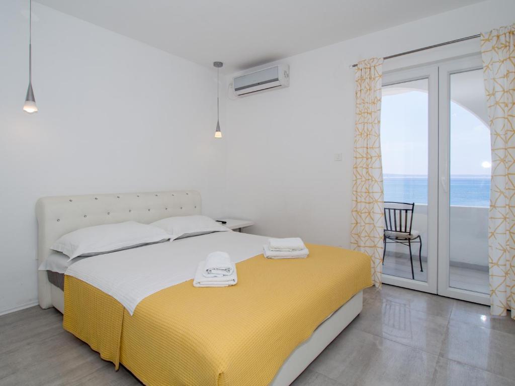 Posteľ alebo postele v izbe v ubytovaní Villa Tamaris on the beach