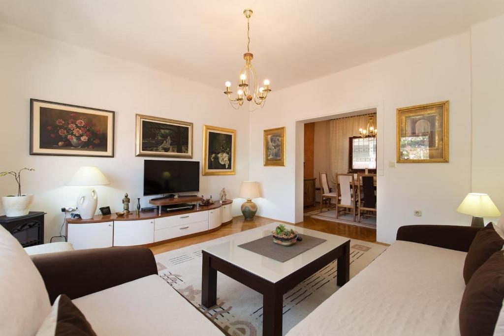 a living room with a couch and a table at Old Town House in Sarajevo in Sarajevo