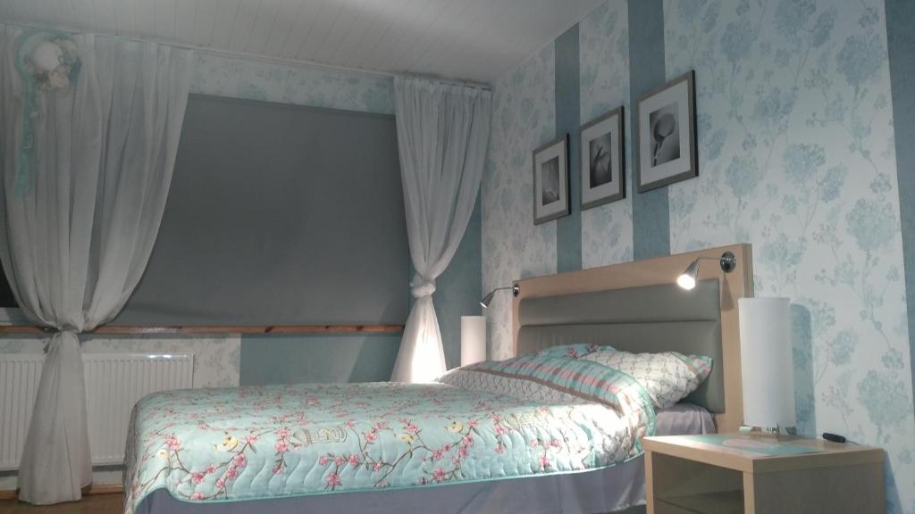 Кровать или кровати в номере Bursztynowa Komnata