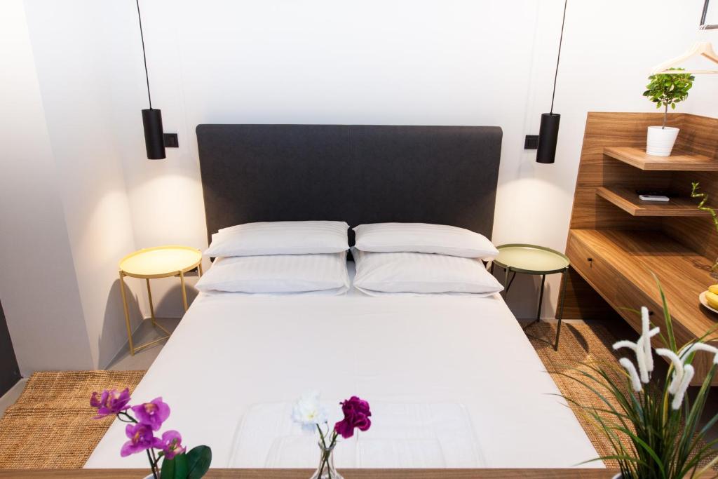 Postel nebo postele na pokoji v ubytování Rooms and Apartments Glossy