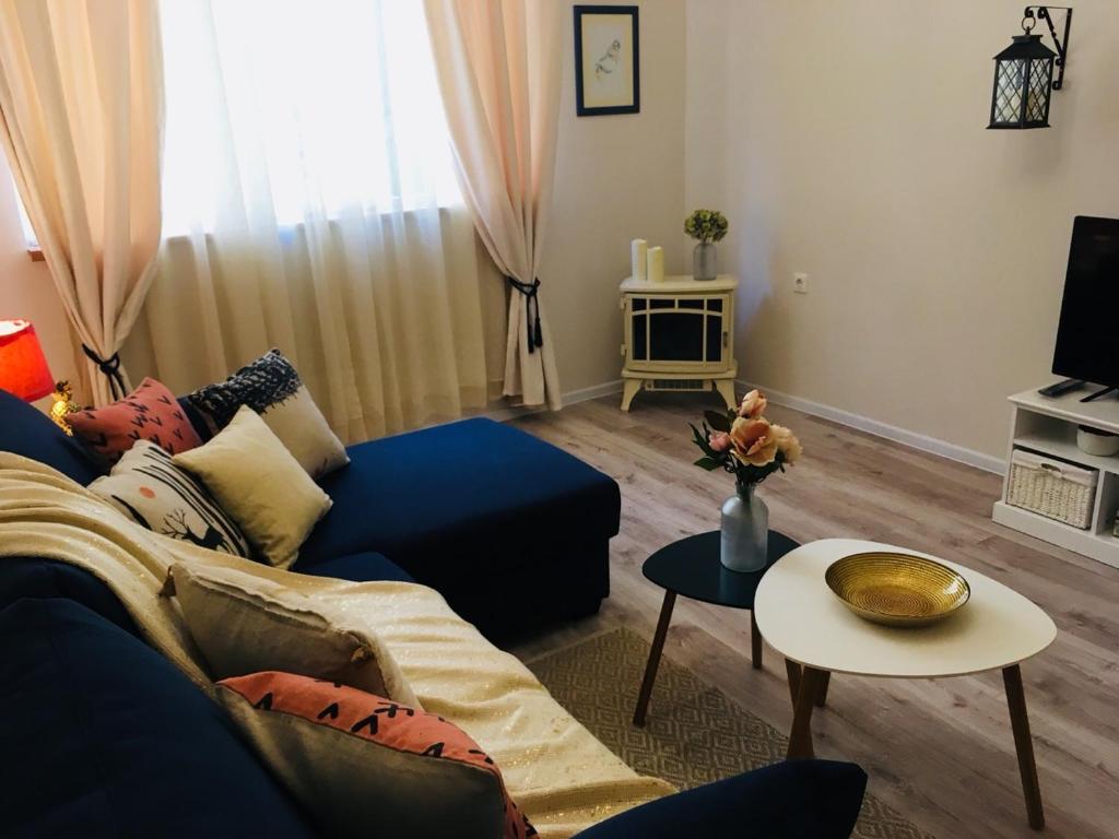 TV a/nebo společenská místnost v ubytování Urban Garden