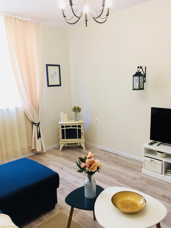 TV a/nebo společenská místnost v ubytování Urban Garden
