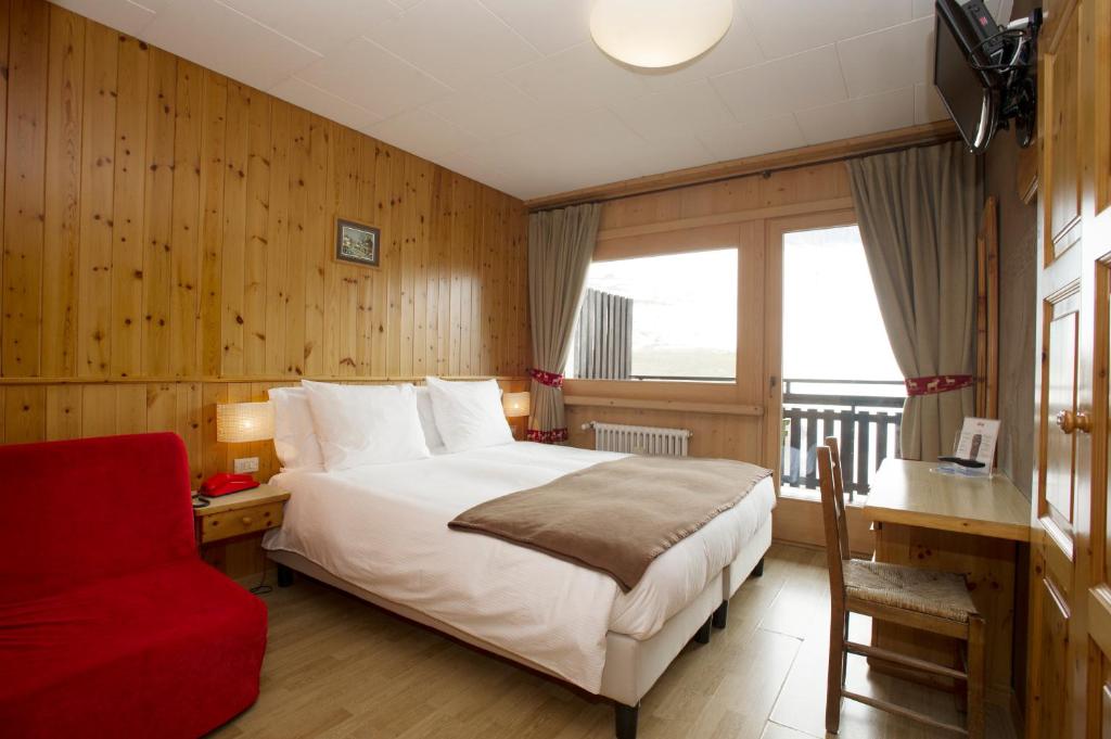Postel nebo postele na pokoji v ubytování Hotel Funivia