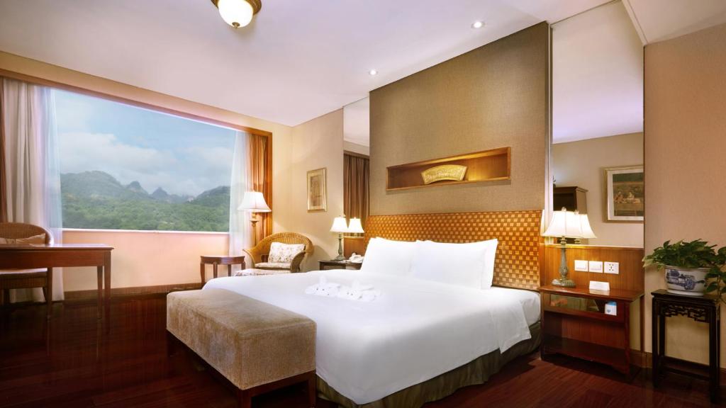 Postel nebo postele na pokoji v ubytování C&D Resort,Wuyi Mountain