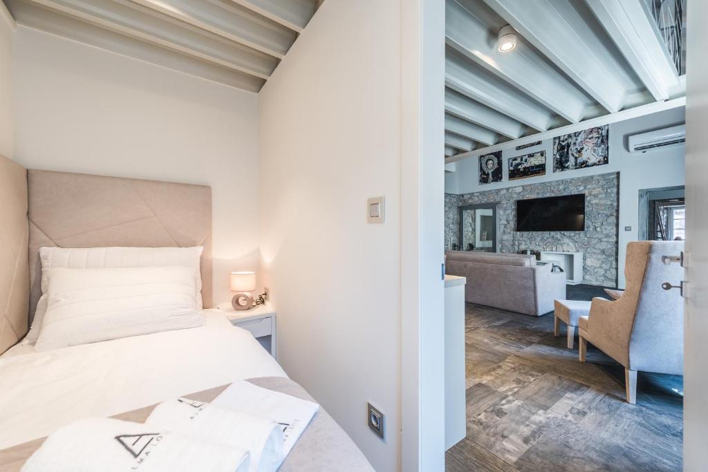 Posteľ alebo postele v izbe v ubytovaní Alma Lofts