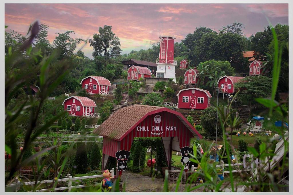 a painting of a red barn in a village at Chill chill farm resort in Phetchabun