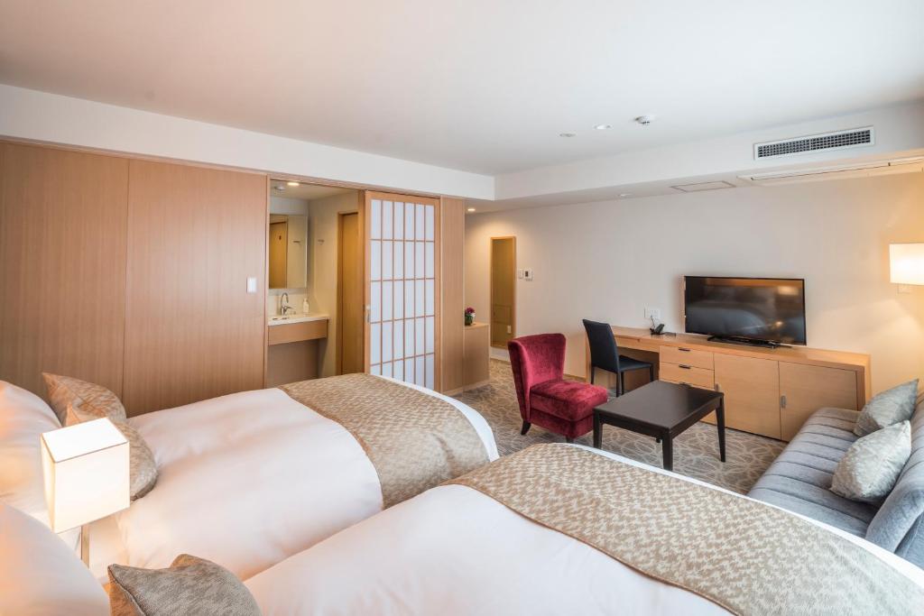 Postel nebo postele na pokoji v ubytování Kyoto Shinmachi Rokkaku Hotel grandereverie