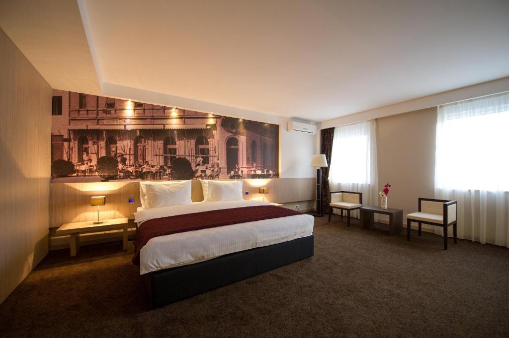 Postel nebo postele na pokoji v ubytování City Hotel Mostar