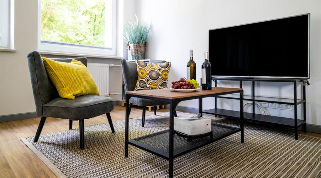 Televízia a/alebo spoločenská miestnosť v ubytovaní A+ apartament Rajska