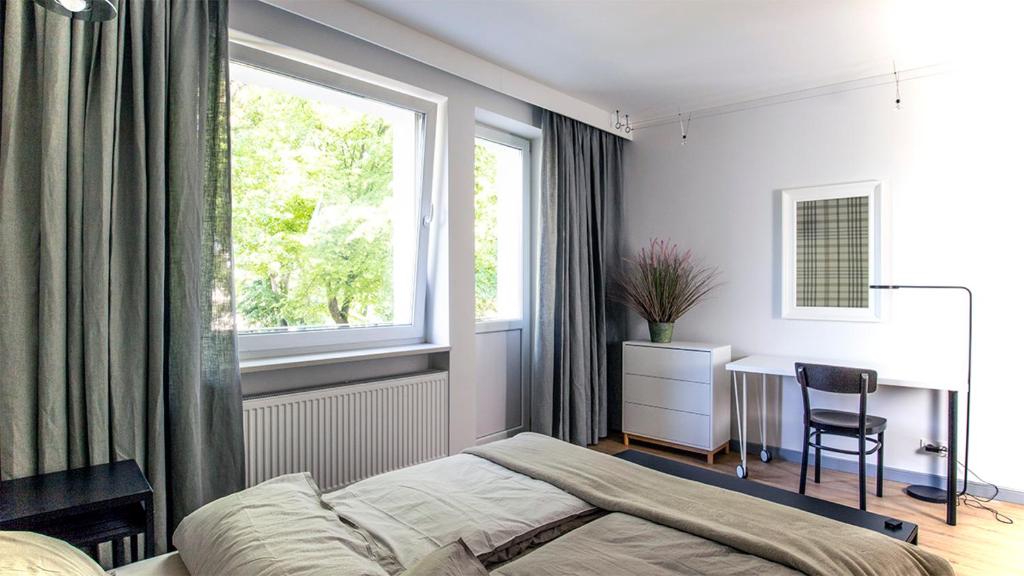 Posteľ alebo postele v izbe v ubytovaní A+ apartament Rajska