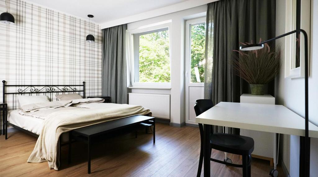Posteľ alebo postele v izbe v ubytovaní A+ apartament Rajska