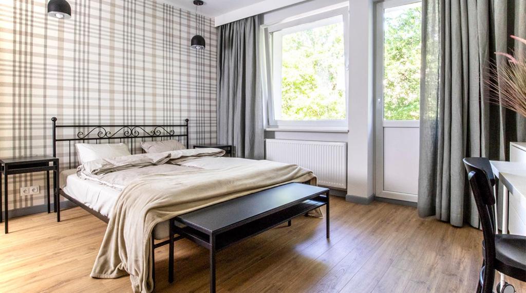 Posteľ alebo postele v izbe v ubytovaní A+ apartament Rajska