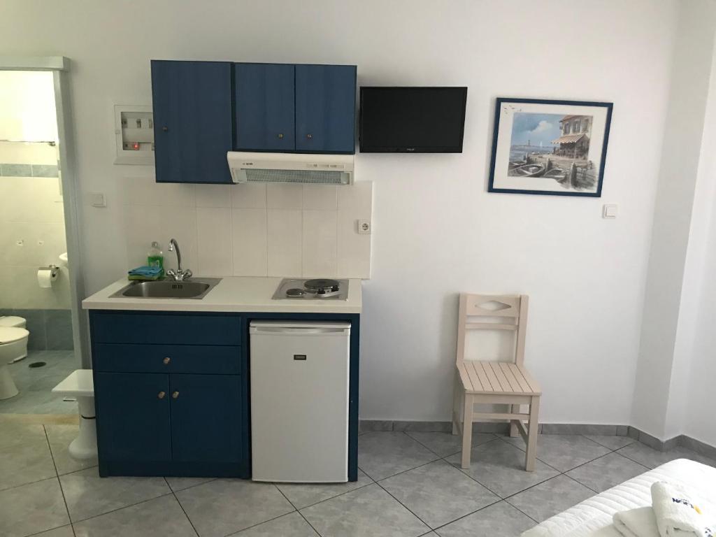 Kuchyň nebo kuchyňský kout v ubytování Ilion Hotel