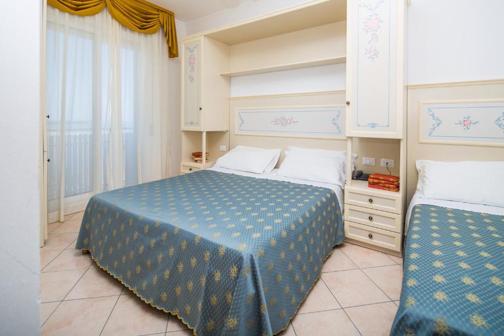 Postel nebo postele na pokoji v ubytování Hotel Principe