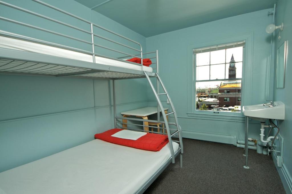 Postel nebo postele na pokoji v ubytování American Hotel Hostel
