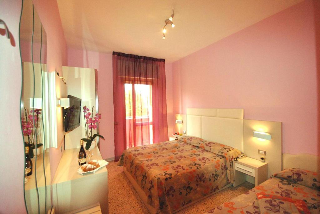 Postel nebo postele na pokoji v ubytování Hotel Prestigio