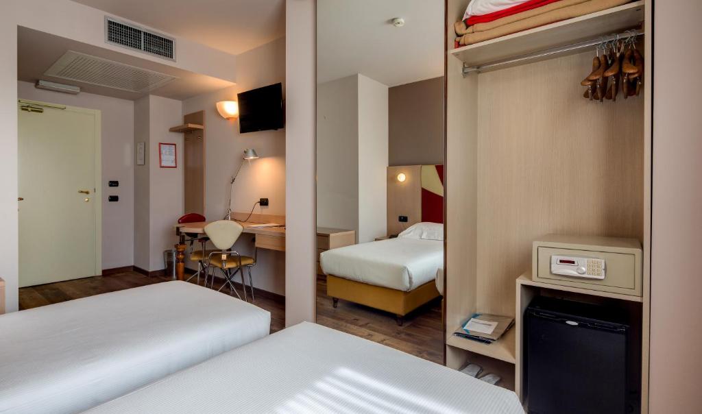 Postel nebo postele na pokoji v ubytování Art & Hotel Aeroporto