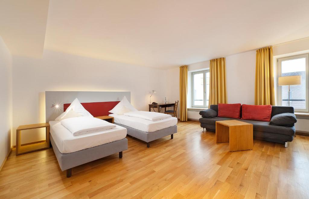 Postel nebo postele na pokoji v ubytování AKZENT Brauerei Hotel Hirsch