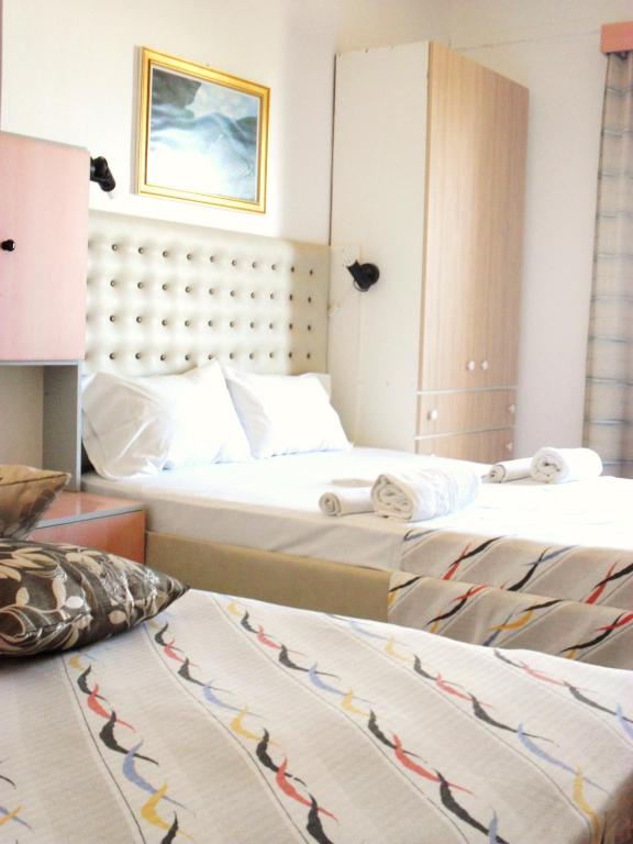 two beds in a hotel room with two beds at La Santre Villa in Amoudara Herakliou