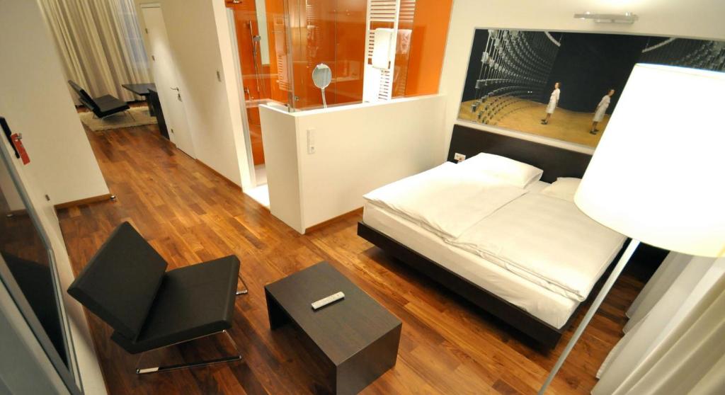 Postel nebo postele na pokoji v ubytování arte Hotel Linz