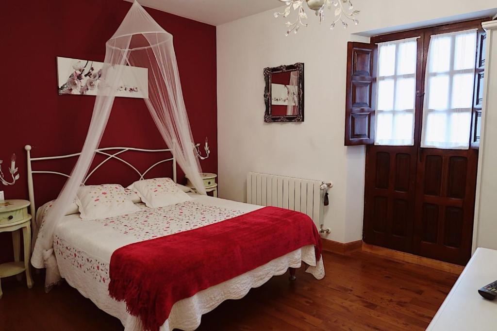 Postel nebo postele na pokoji v ubytování Trisileja en Posada La Busta