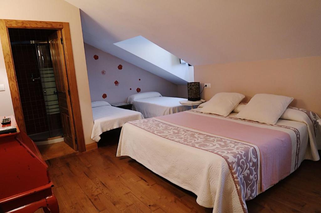Postel nebo postele na pokoji v ubytování Trisileja en Posada La Busta