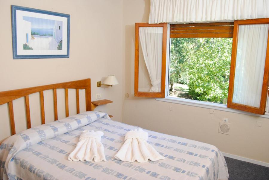 Ένα ή περισσότερα κρεβάτια σε δωμάτιο στο Hotel Norte