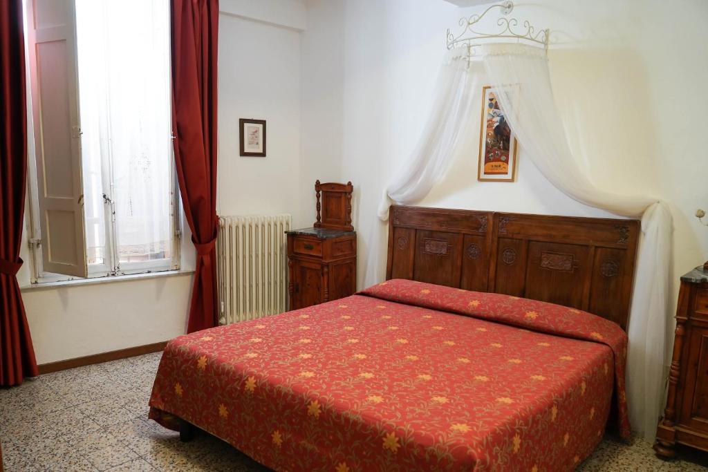 Postel nebo postele na pokoji v ubytování Albergo Tre Donzelle