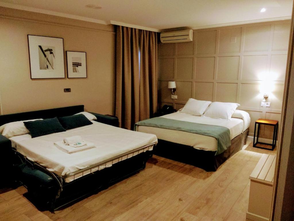 Posteľ alebo postele v izbe v ubytovaní Hotel Doña Blanca