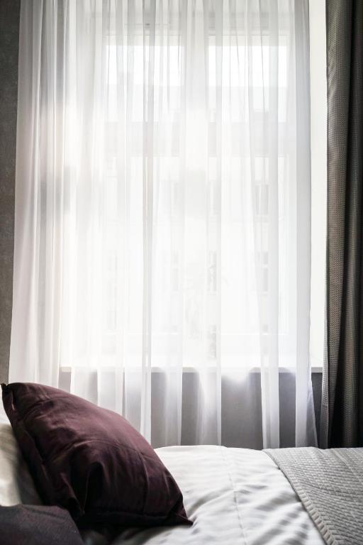 Posteľ alebo postele v izbe v ubytovaní oompH Koszyki Luxurious Apartments