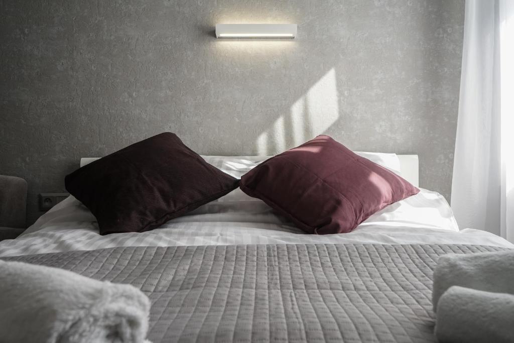 Posteľ alebo postele v izbe v ubytovaní oompH Koszyki Luxurious Apartments