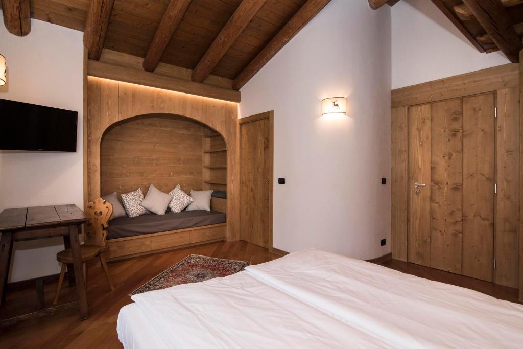 Postel nebo postele na pokoji v ubytování Ca'Milla B&B nelle Dolomiti