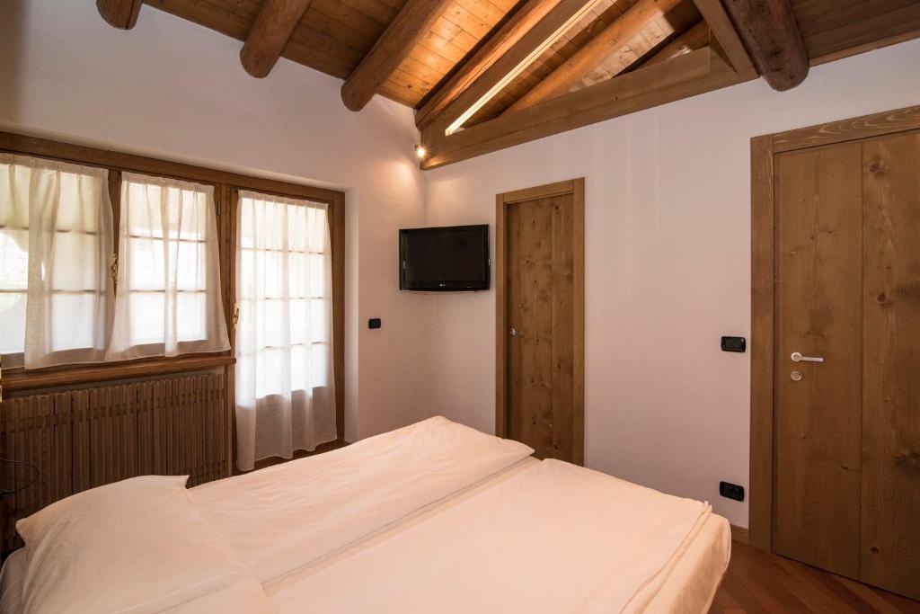 Postel nebo postele na pokoji v ubytování Ca'Milla B&B nelle Dolomiti
