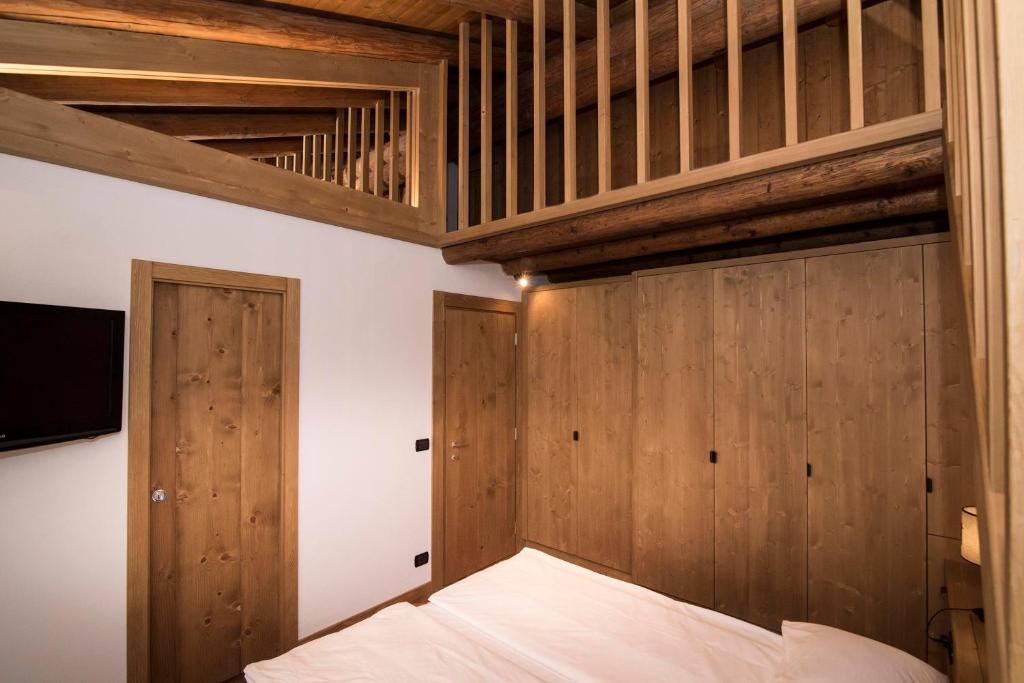 Postel nebo postele na pokoji v ubytování Ca'Milla B&B nelle Dolomiti