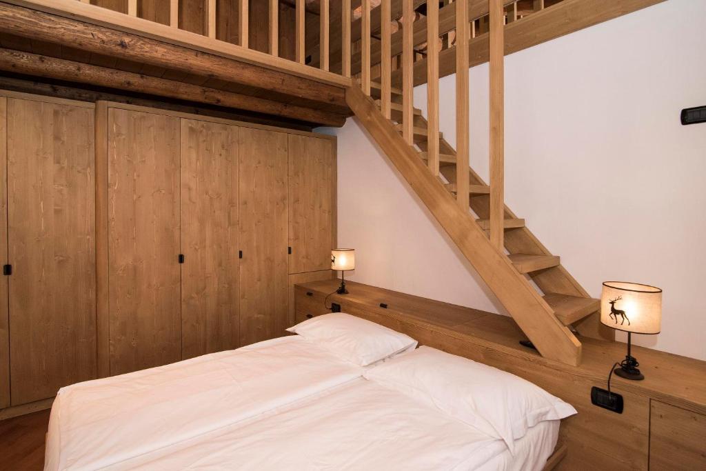 Postel nebo postele na pokoji v ubytování Ca'Milla B&B nelle Dolomiti