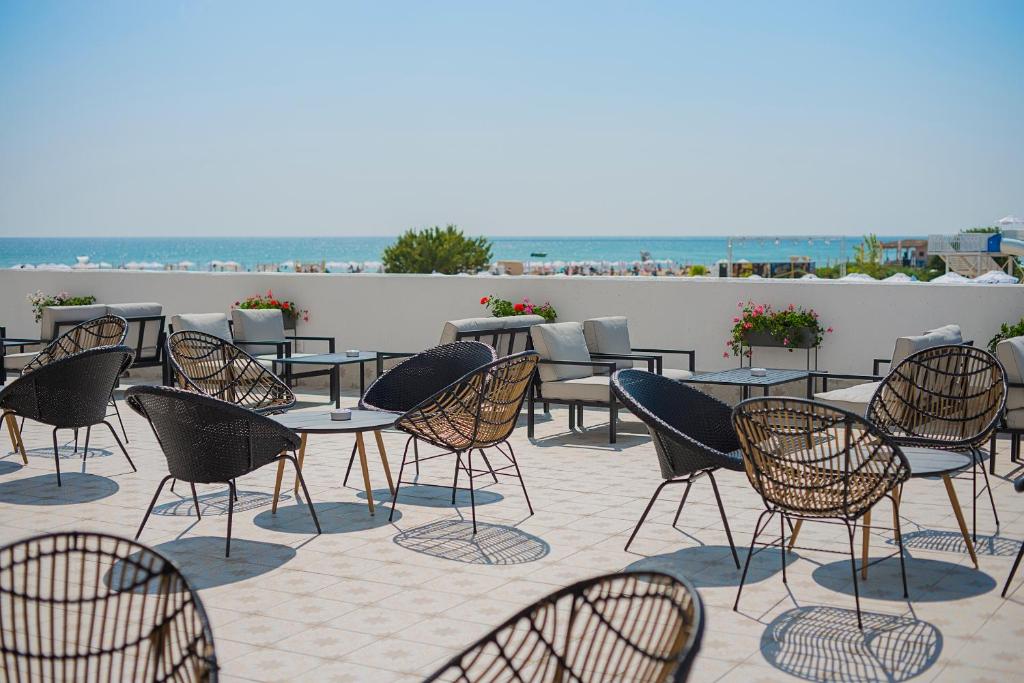 a group of tables and chairs on a patio at Sunrise Blue Magic Resort - All Inclusive in Obzor