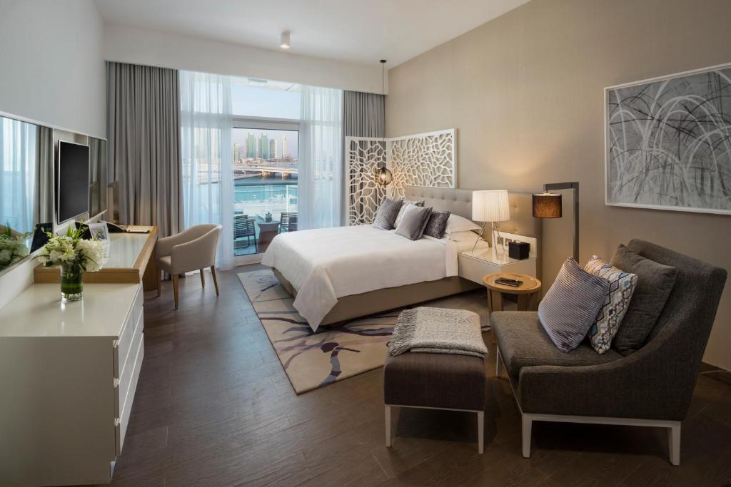 Voodi või voodid majutusasutuse Beach Rotana Residences toas