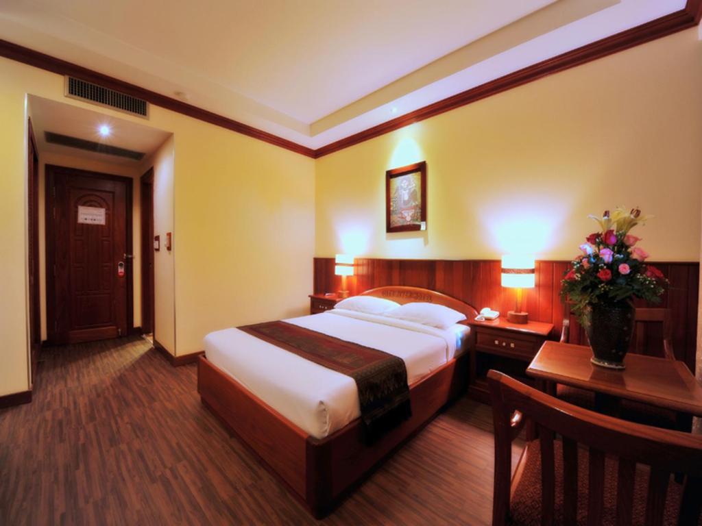 Postel nebo postele na pokoji v ubytování City River Hotel