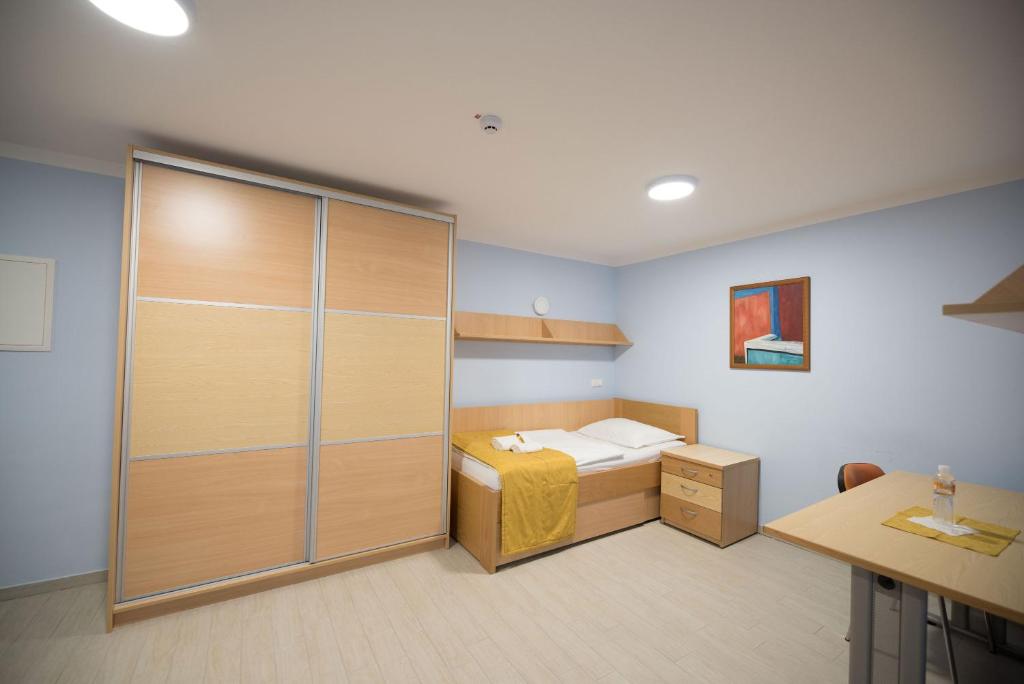 Postel nebo postele na pokoji v ubytování S Hotel