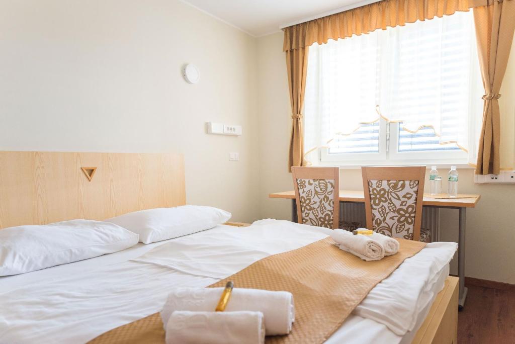 Postel nebo postele na pokoji v ubytování S Hotel