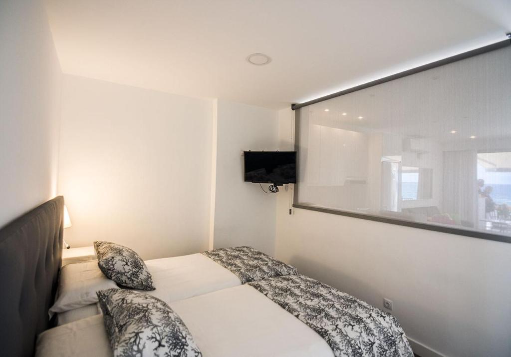 Postel nebo postele na pokoji v ubytování La Grand Suite Las Canteras