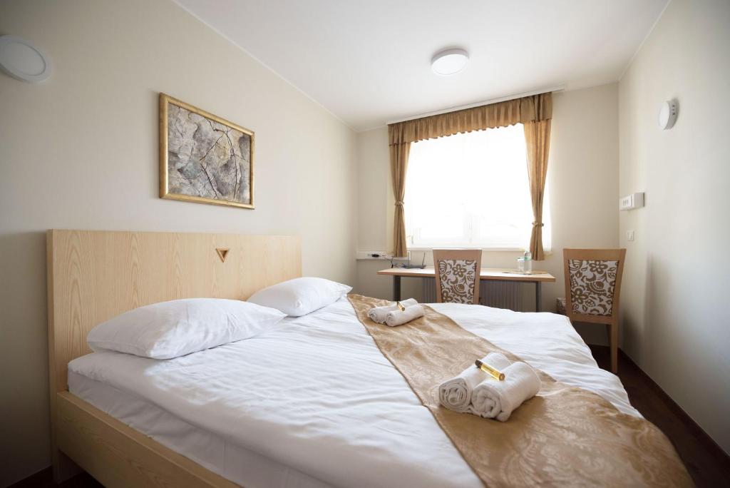 Postel nebo postele na pokoji v ubytování S Hotel