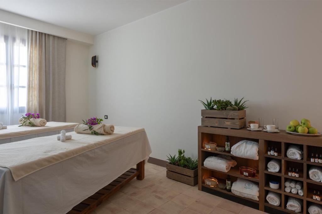 A bed or beds in a room at Momentum Wellness Bioresort