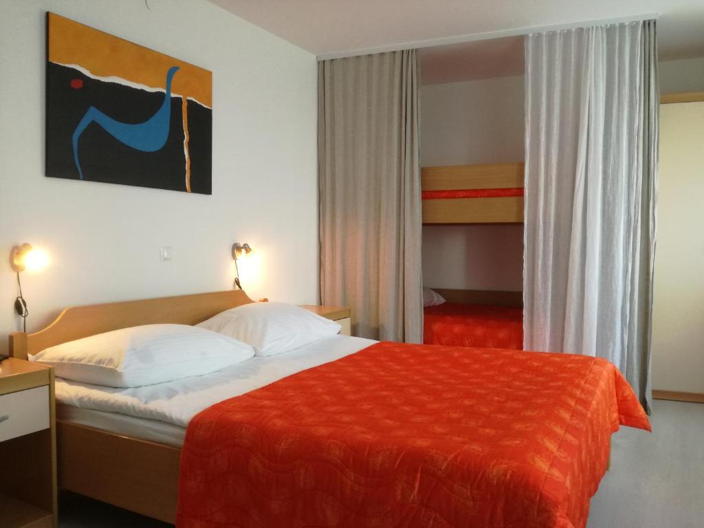 Postel nebo postele na pokoji v ubytování Hotel garni Paleta