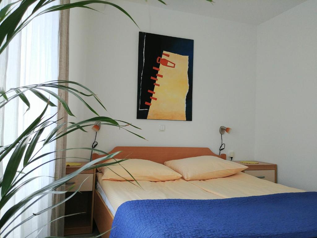 Postel nebo postele na pokoji v ubytování Hotel garni Paleta
