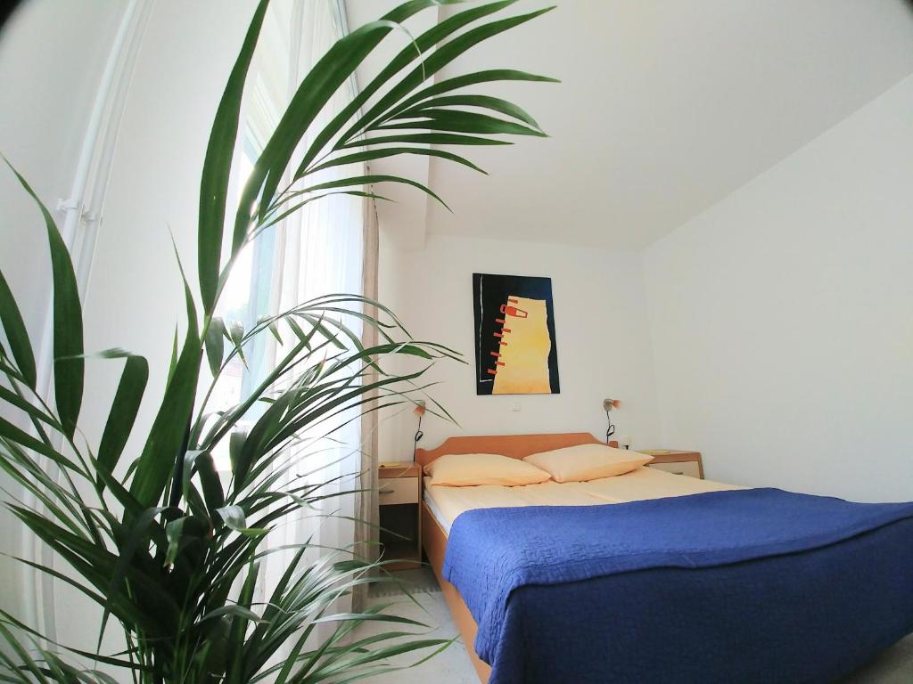 Postel nebo postele na pokoji v ubytování Hotel garni Paleta